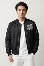 Japanese Tiger Bomber Jacket 'Kinko' – black version, bomber jacket with embroidered white tiger face, front view on model
