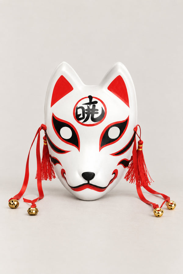 Kanji Kitsune Mask 'Akatsuki' – white kitsune fox mask with a kanji character in a red circle on the brow, red tassels and bells, Japanese kitsune festival mask, studio view