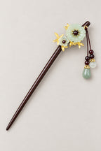 Kanzashi – kanzashi hair stick with pale green flower, gold leaves and green bead tassel, studio view