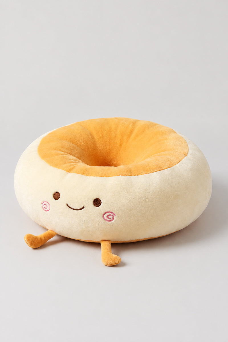 Kawaii Bread Bun Cushion 'Panza' – golden plush bread bun ring cushion with a surprised embroidered face, kawaii Japanese seat cushion, studio view