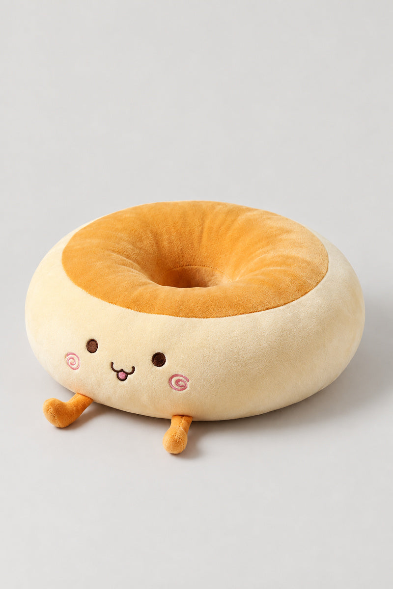 Kawaii Bread Bun Cushion 'Panza' – golden plush bread bun ring cushion with a content embroidered face, kawaii Japanese seat cushion, studio view