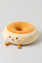 Kawaii Bread Bun Cushion 'Panza' – golden plush bread bun ring cushion with a content embroidered face, kawaii Japanese seat cushion, studio view