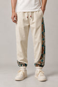Kimono Panel Floral Joggers 'Hanaobi' – cream joggers with kimono floral print side panel, Japanese streetwear pants, front view on model
