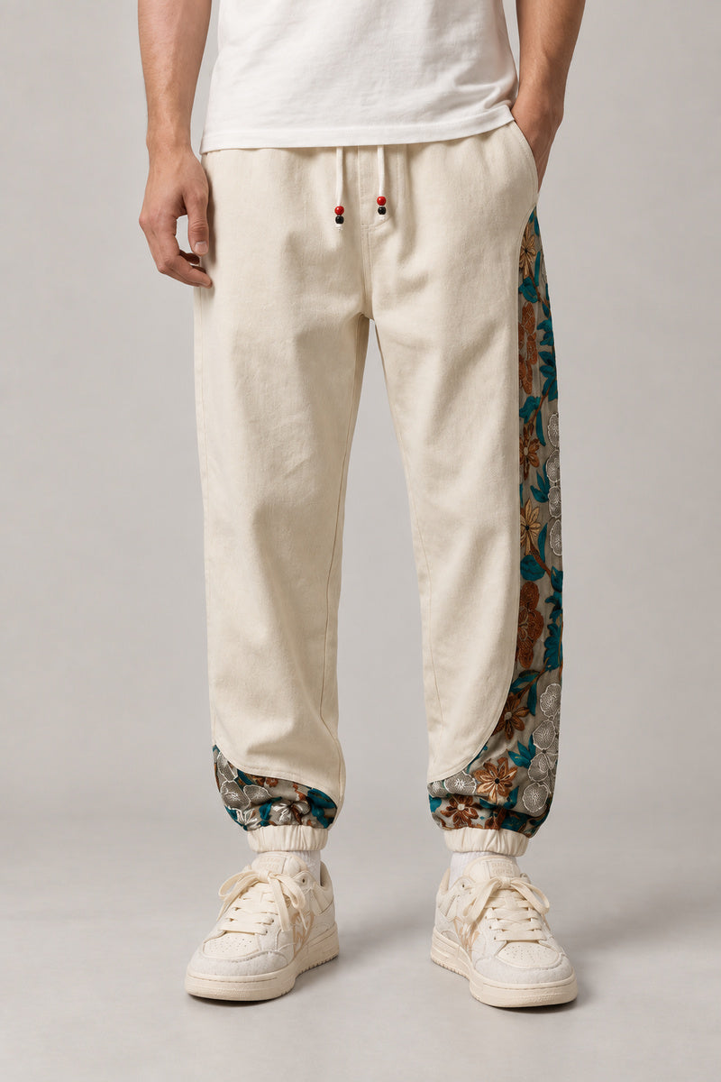 Kimono Panel Floral Joggers 'Hanaobi' – cream joggers with kimono floral print side panel, Japanese streetwear pants, front view on model