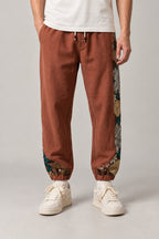 Kimono Panel Floral Joggers 'Hanaobi' – rust kimono panel floral joggers, front view on model