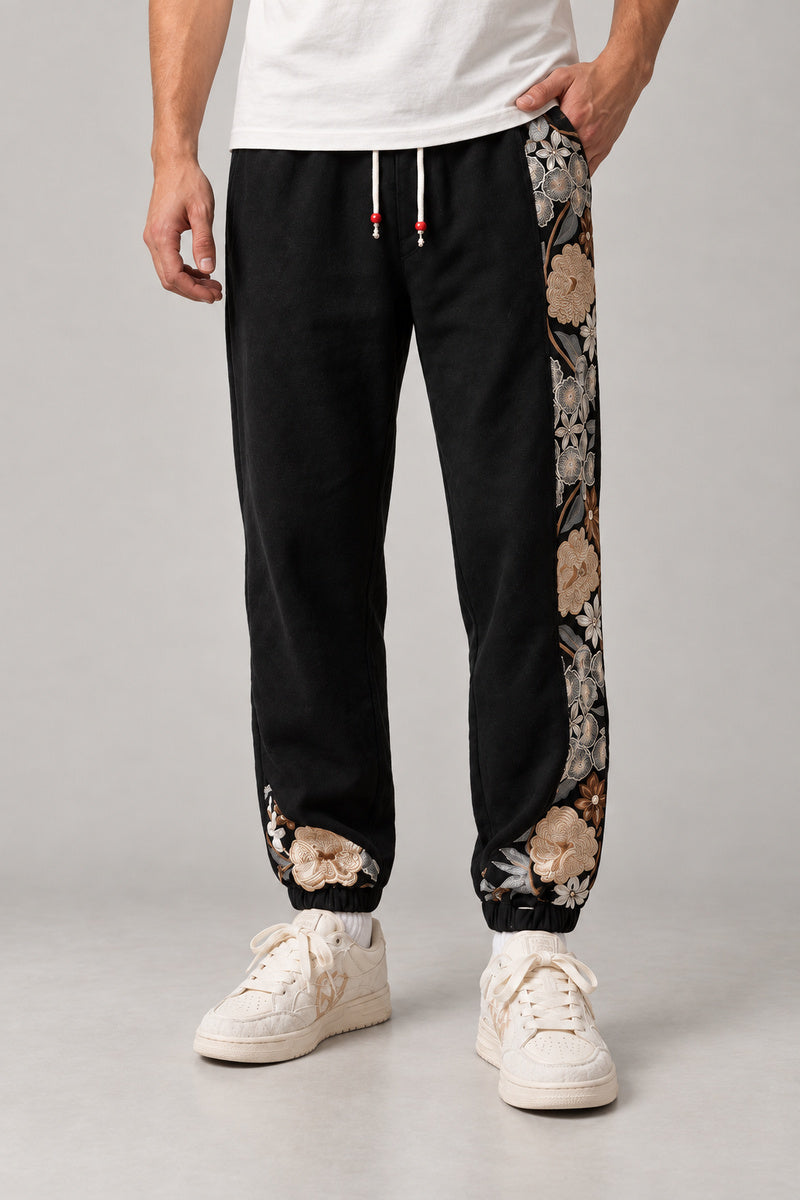 Kimono Panel Floral Joggers 'Hanaobi' – black version of the kimono panel floral joggers, front view on model
