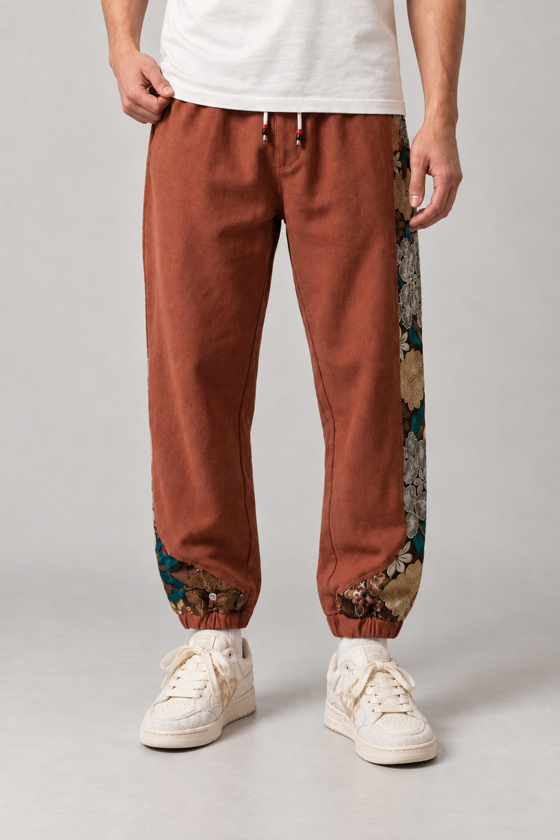 Kimono Panel Floral Joggers 'Hanaobi' – rust version of the kimono panel floral joggers, front view on model