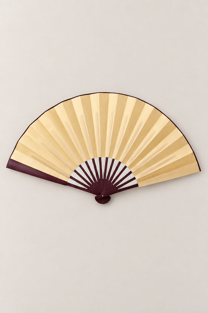 Large Japanese Fan 'Ogi' – gold version of the large plain folding dance fan on dark ribs, open, studio view
