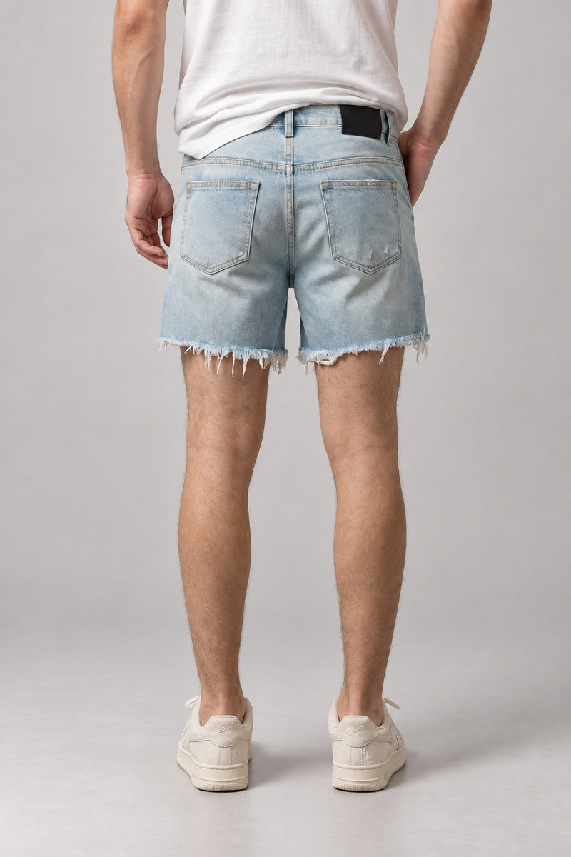 Light Wash Cut Off Denim Shorts 'Kirippa' – back view of the light wash cut off denim shorts, on model