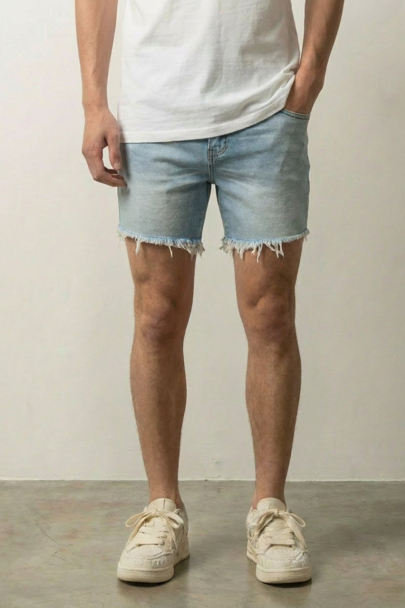 Light Wash Cut Off Denim Shorts 'Kirippa' – light wash cut off denim shorts with frayed raw hem, front view on model, studio
