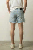 Light Wash Cut Off Denim Shorts 'Kirippa' – back view on model, studio