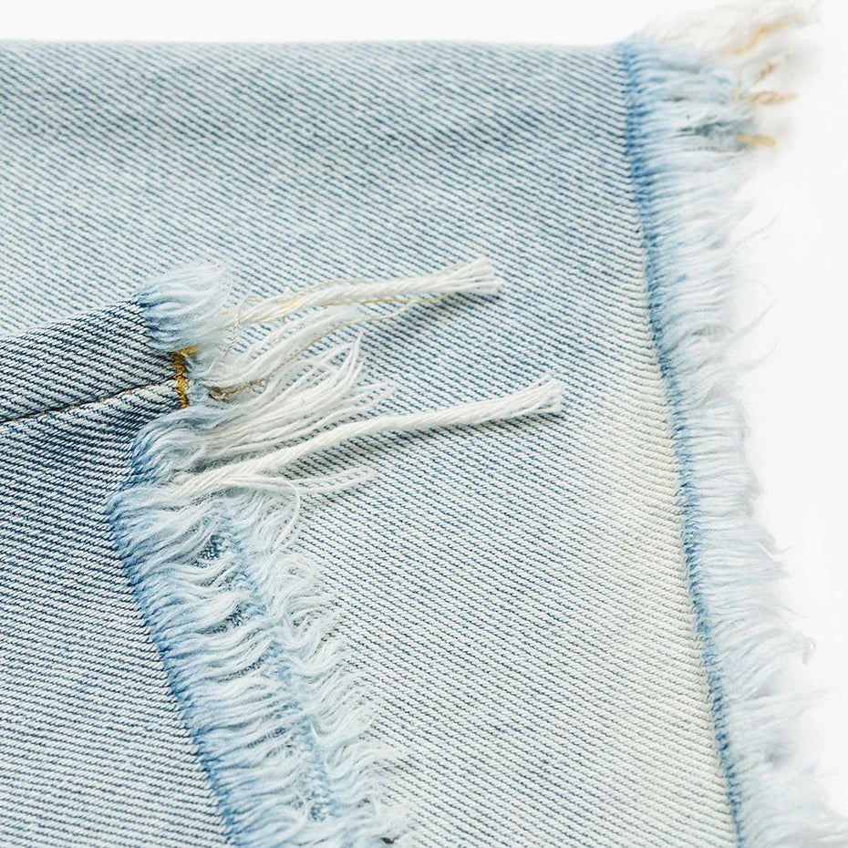 Light Wash Cut Off Denim Shorts 'Kirippa' – close-up detail of the frayed cut off hem