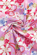 Lilac Sakura Furoshiki Fabric 'Sakurayume' – lilac furoshiki printed with cherry blossom, small blue flowers and gold, Japanese furoshiki wrapping cloth 50 by 145 cm, close-up of the print
