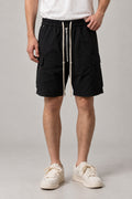 Long Black Cargo Shorts 'Kurokage' – long black cargo shorts with drawstring waist and side pockets, Japanese streetwear shorts, front view on model