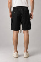 Long Black Cargo Shorts 'Kurokage' – back view of the long black cargo shorts, on model
