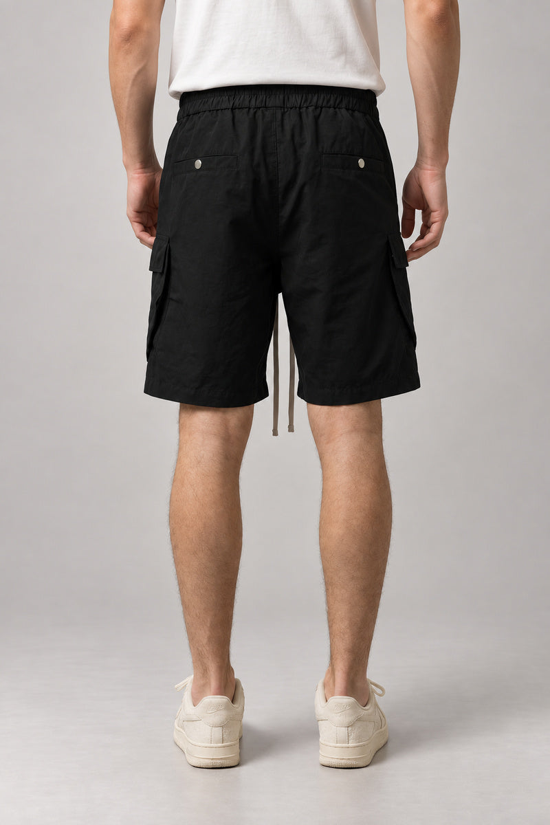 Long Black Cargo Shorts 'Kurokage' – back view of the long black cargo shorts, on model