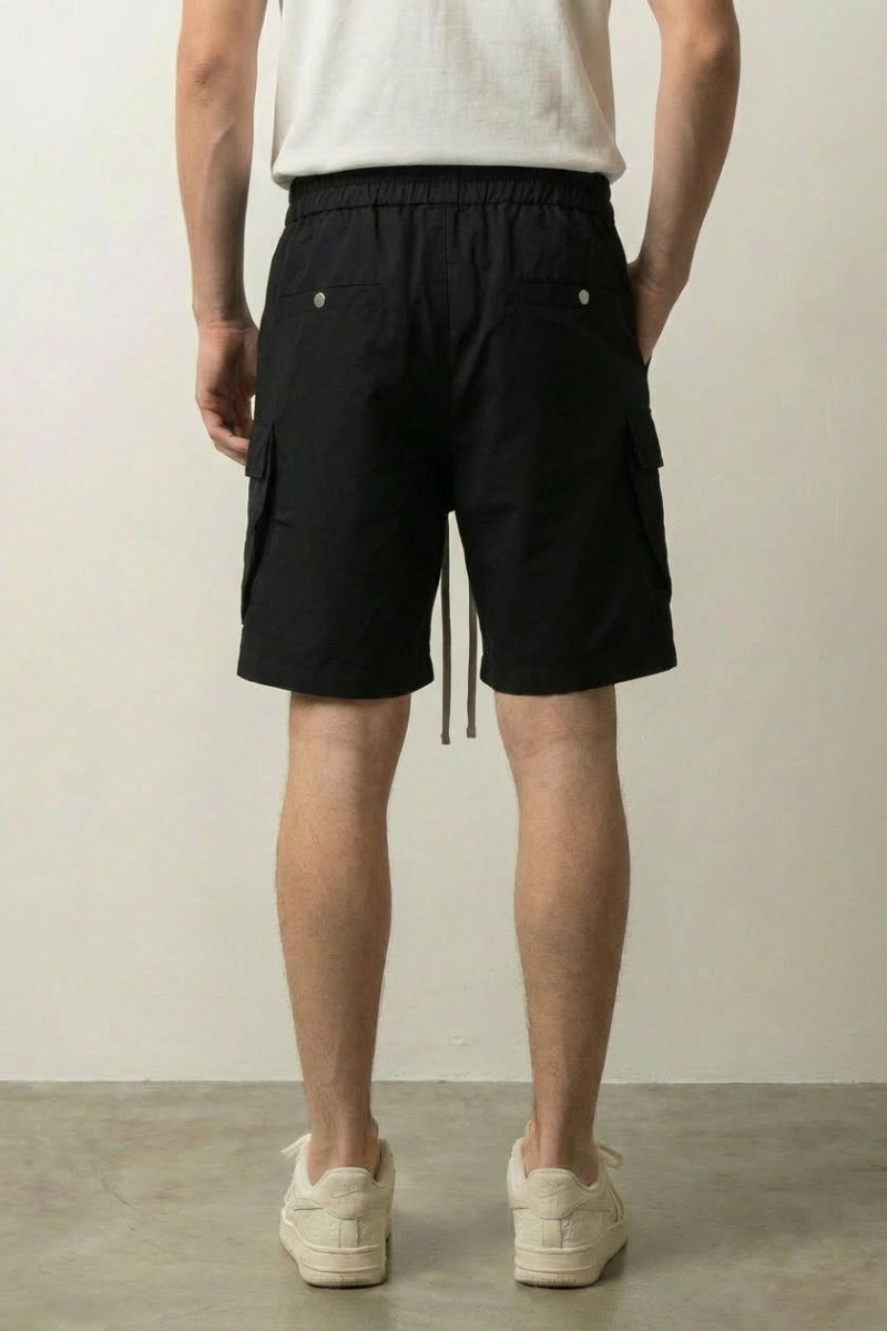 Long Black Cargo Shorts 'Kurokage' – back view on model, studio