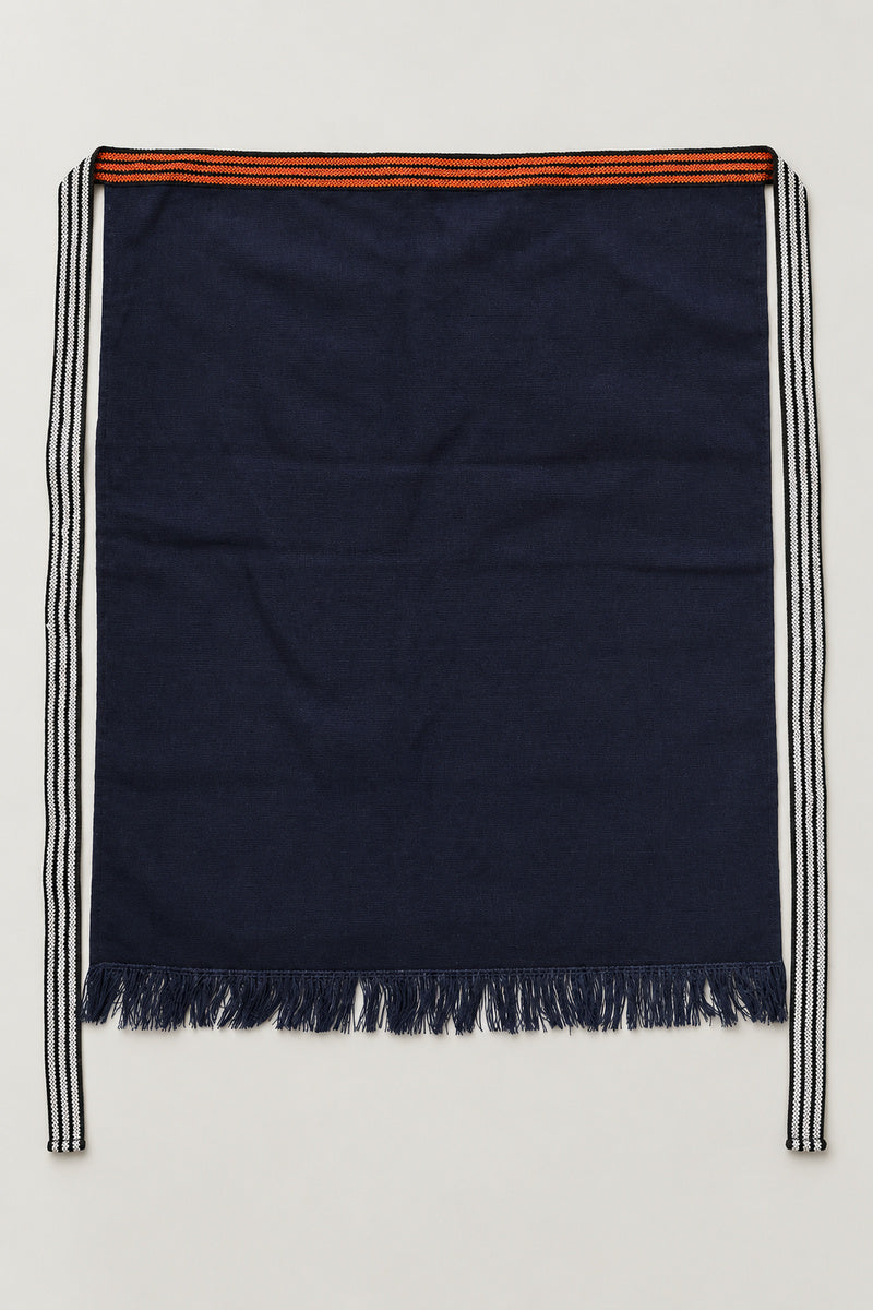 Maekake – plain indigo maekake waist apron with fringed hem and striped ties, traditional Japanese sake brewery waist apron with fringed hem, studio view