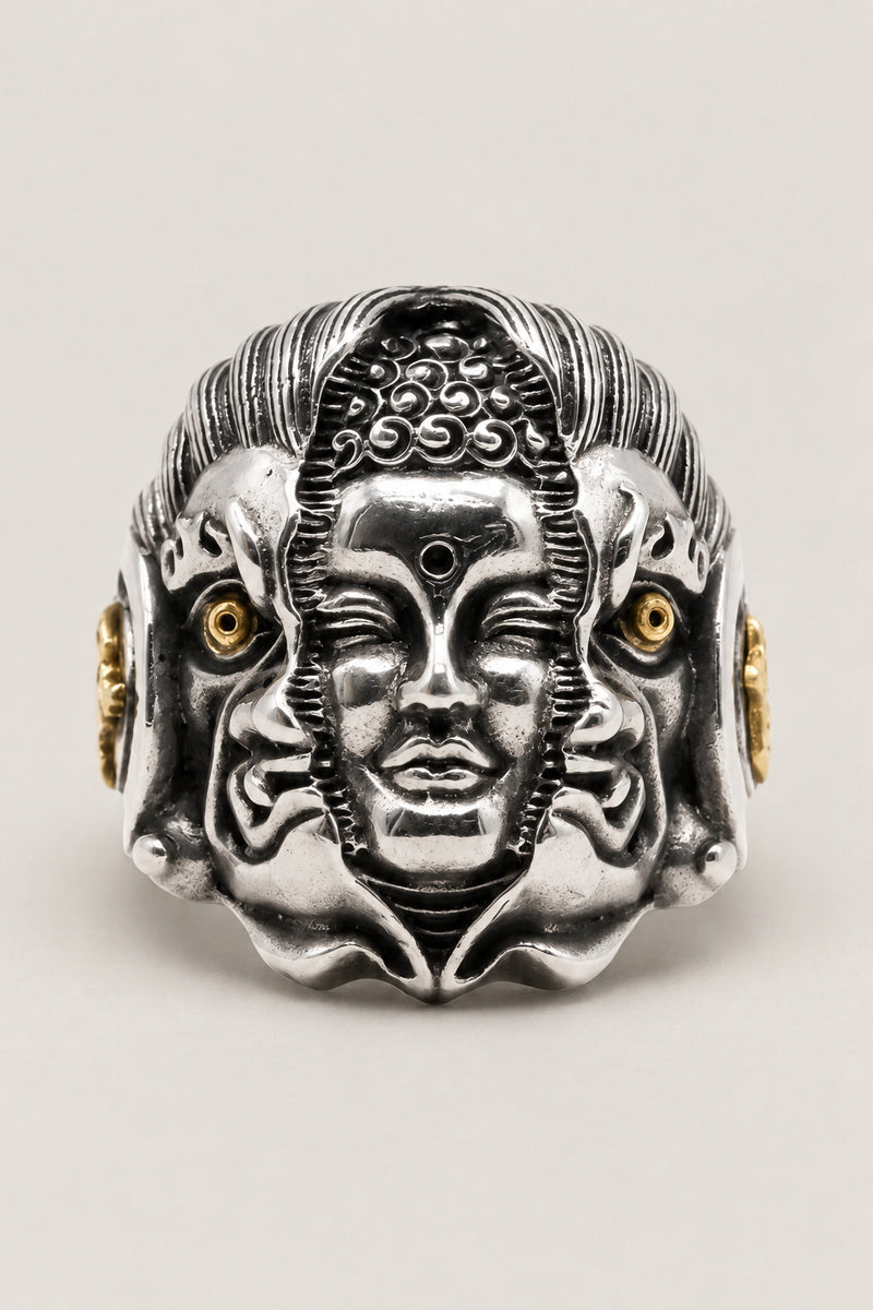 Many Faces Ring 'Kannon' – sterling silver ring of a serene Kannon face flanked by two smaller faces with gold eyes, Japanese Buddhist ring, studio view