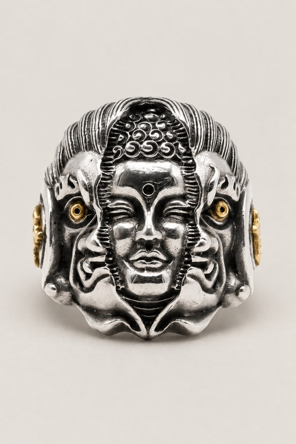 Many Faces Ring 'Kannon' – sterling silver ring of a serene Kannon face flanked by two smaller faces with gold eyes, Japanese Buddhist ring, studio view