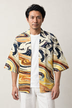 Marbled Haori Kimono Jacket 'Ryusui' – cream haori jacket with gold, blue and black marbled flowing water print, unisex Japanese kimono style cardigan, front view on model