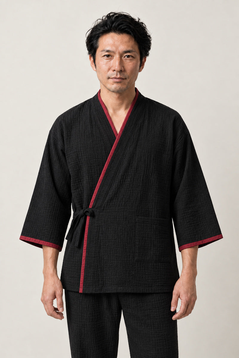 Men's Black Crimson Trim Jinbei 'Kurobeni' – black men's jinbei with crimson red trim, two-piece Japanese jinbei set with side-tie top and shorts, front view on model