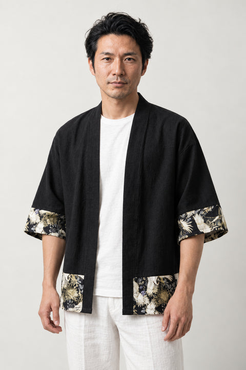 Men's Black Floral Kimono Shirt 'Yozakura' – black men's kimono shirt with gold floral print hem and cuffs, Japanese haori style jacket, front view on model