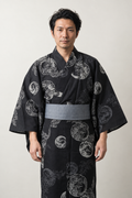 Men's Black Wave Yukata 'Shiranami' – black men's yukata with grey circular wave crest print and grey obi belt, Japanese kimono robe, front view on model