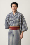 Men's Checkered Kimono 'Ichimatsu' – black and white checkered ichimatsu print men's kimono with dark red obi belt, Japanese yukata robe, front view on model