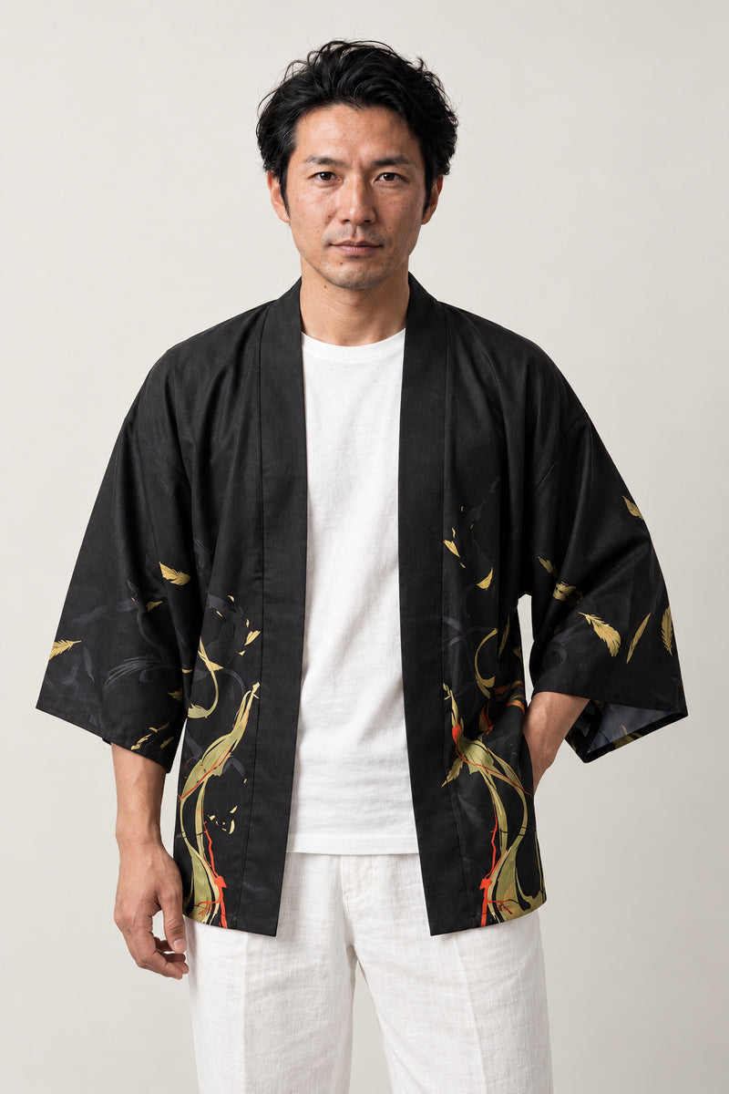Men's Ember Print Kimono Jacket 'Hinoko' – black men's kimono jacket with orange ember and flame print, three-quarter sleeve haori style, front view on model