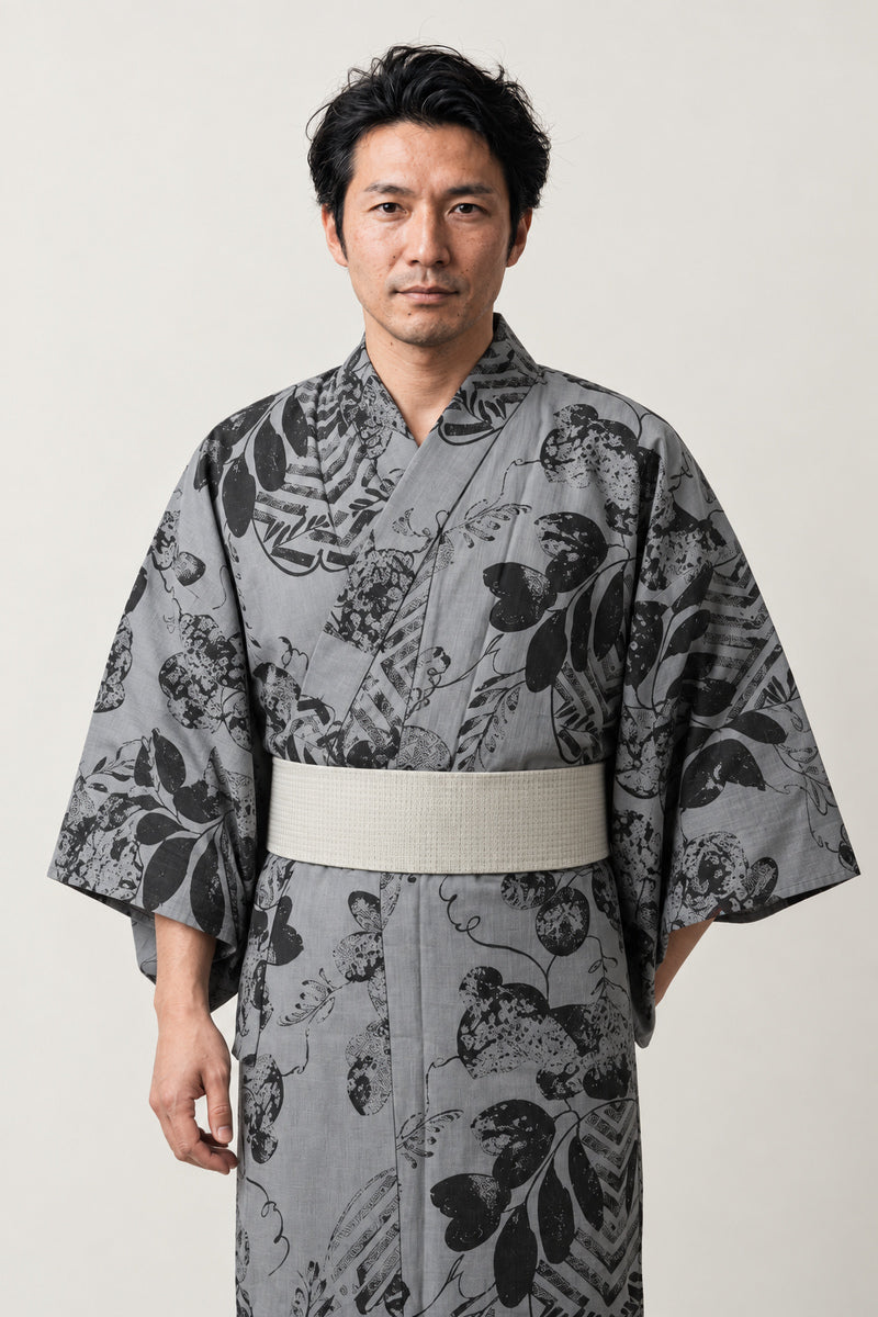 Men's Grey Floral Yukata 'Sumibana' – grey men's yukata with tonal black floral print and grey obi belt, Japanese kimono robe, front view on model