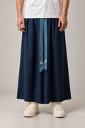 Men's Indigo Wide Hakama 'Tsuyukusa' – indigo blue pleated wide hakama with front ties, traditional Japanese men's samurai trousers, front view on model