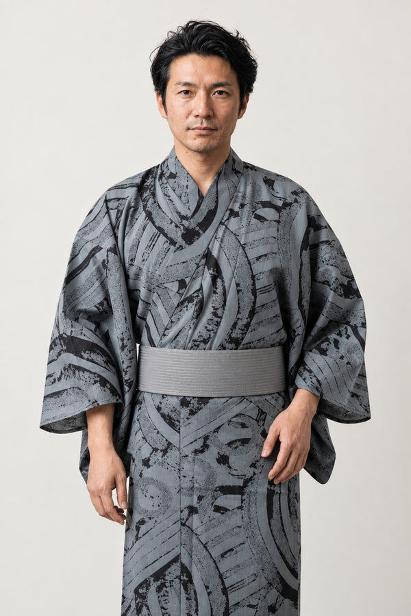 Men's Ink Wash Kimono 'Bokuseki' – grey men's kimono with black ink wash brushstroke print and grey obi, Japanese yukata robe, front view on model