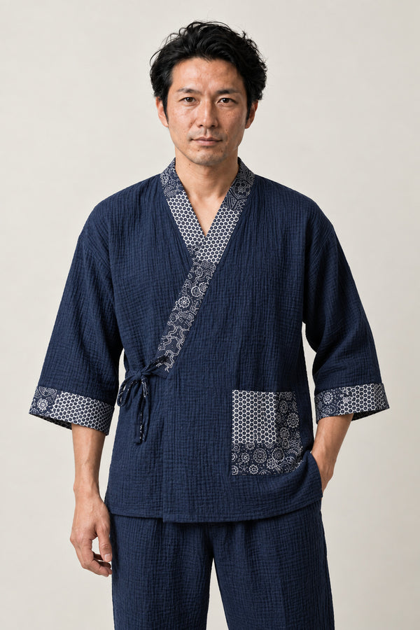 Men's Japanese Summer Pajamas 'Edokomon' – navy men's summer jinbei with Edo komon pattern trim and pocket, two-piece Japanese jinbei set with side-tie top and shorts, front view on model