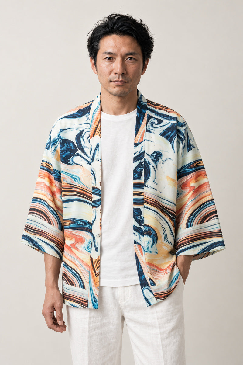 Men's Marbled Wave Kimono Jacket 'Uzushio' – cream men's kimono jacket with blue and orange marbled wave print, Japanese haori style cardigan, front view on model