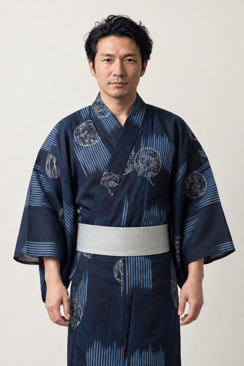 Men's Medallion Kimono 'Tatewaku' – navy men's kimono with round medallion crest print and grey obi belt, Japanese yukata robe, front view on model