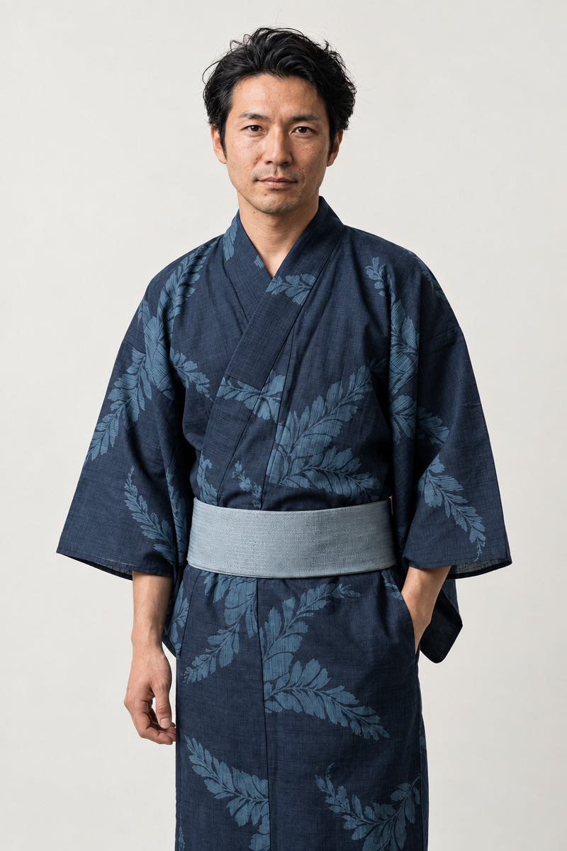 Men's Navy Fern Yukata 'Shinobu' – navy men's yukata with grey fern leaf print and grey obi belt, traditional Japanese kimono robe, front view on model