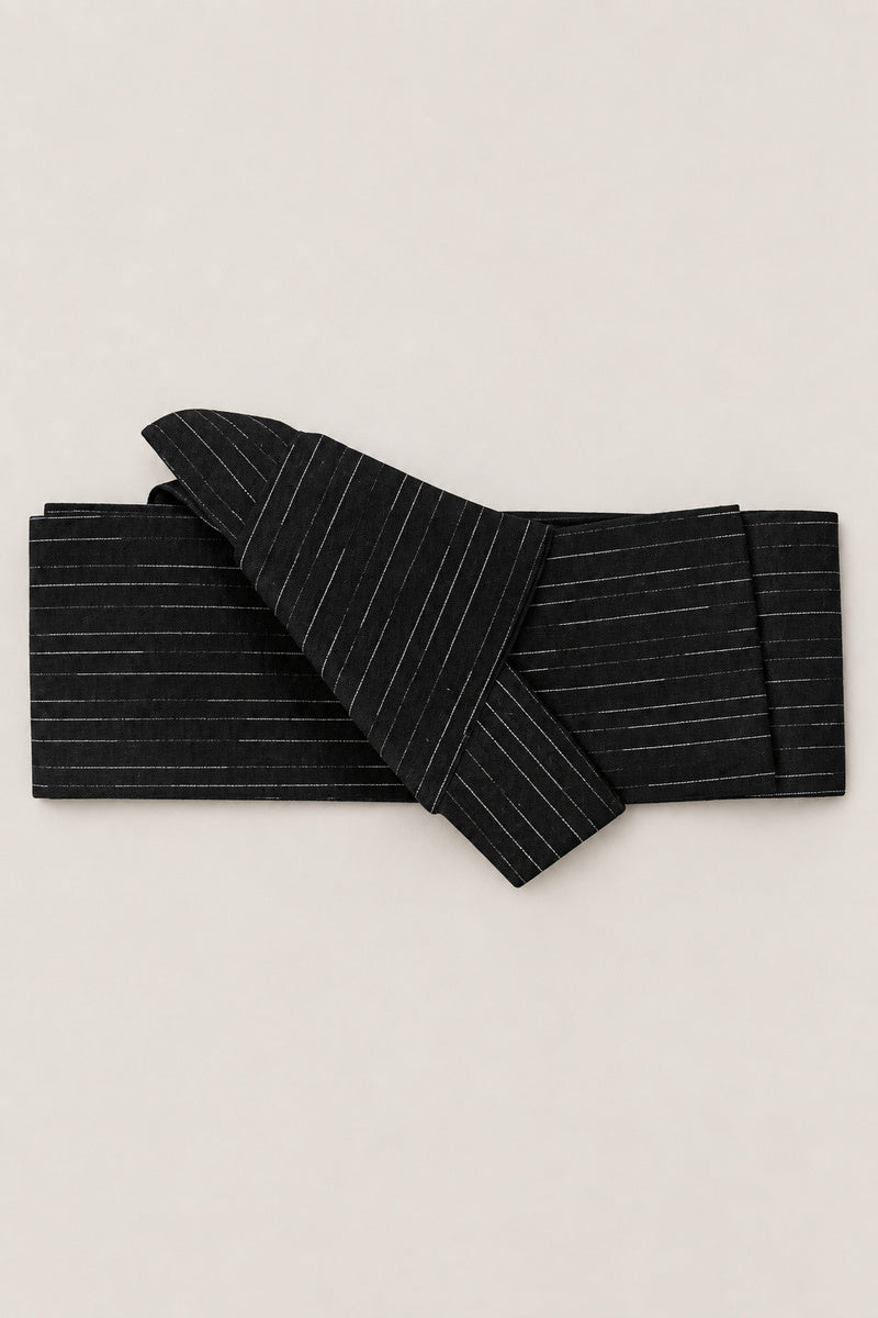 Men's Obi Belt 'Ginsuji' – black obi belt with fine silver pinstripes, narrow pre-tied Japanese obi belt with sewn knot and hidden adjustable closure, for kimono, yukata or jinbei, studio view