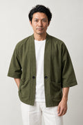 Men's Olive Utility Kimono Jacket 'Uguisu' – olive green men's utility kimono jacket with patch pockets and toggle, Japanese noragi style cardigan, front view on model