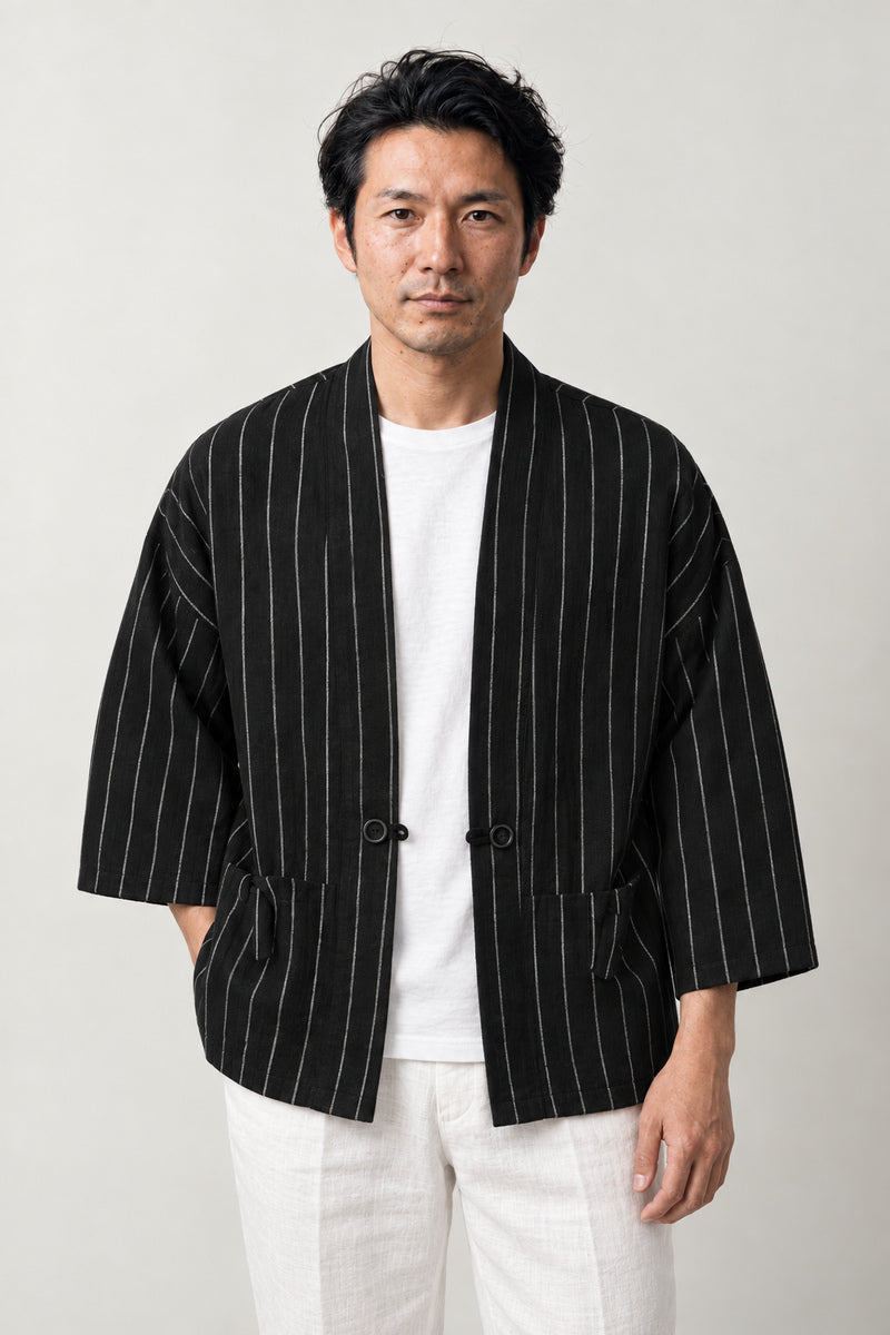 Men's Pinstripe Kimono Jacket 'Sensuji' – black pinstripe men's kimono jacket with front pockets, Japanese haori style cardigan, front view on model