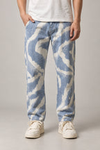 Men's Tie Dye Jeans 'Kumoshibori' – light blue tie dye cloud print men's jeans, Japanese streetwear denim, front view on model