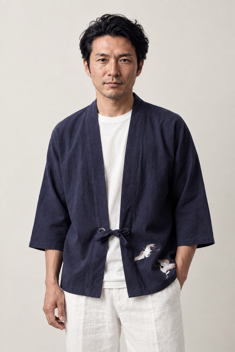 Men's Twin Crane Kimono Cardigan 'Sokaku' – navy men's kimono cardigan with two embroidered white cranes and front tie, Japanese haori style jacket, front view on model