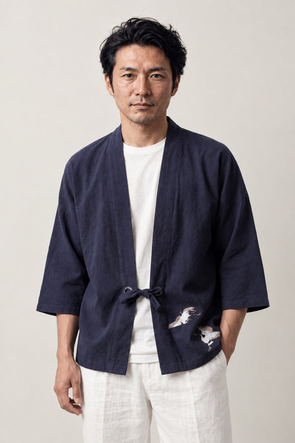 Men's Twin Crane Kimono Cardigan 'Sokaku' – navy men's kimono cardigan with two embroidered white cranes and front tie, Japanese haori style jacket, front view on model