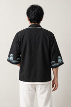 Men's Wave Trim Kimono Jacket 'Aranami' – back view of black kimono jacket with Japanese wave print on the sleeves and white piping