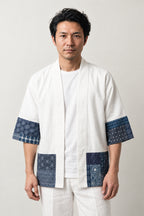 Men's White Patchwork Kimono Jacket 'Aizuri' – white men's kimono jacket with indigo boro patchwork print hem and cuffs, Japanese haori style cardigan, front view on model