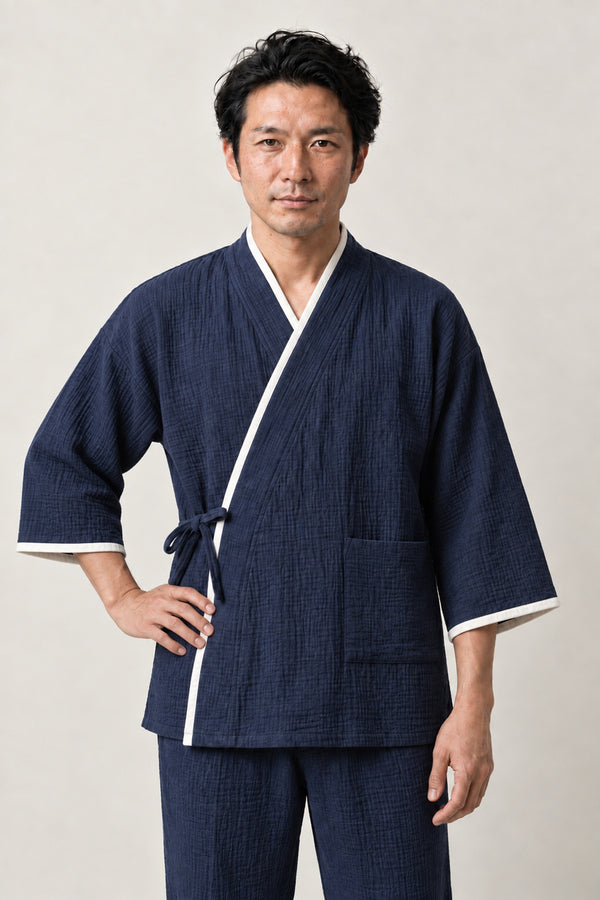 Men's White Trim Japanese Pyjamas 'Hakuen' – navy men's jinbei pyjamas with white contrast trim, two-piece Japanese jinbei set with side-tie top and shorts, front view on model