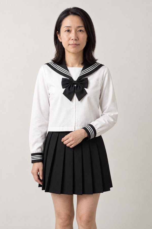 Monochrome Sailor Uniform 'Kokubyaku' – white long sleeve sailor top with black collar and bow and black pleated skirt, monochrome Japanese school uniform seifuku set, sailor top and pleated skirt, front view on model