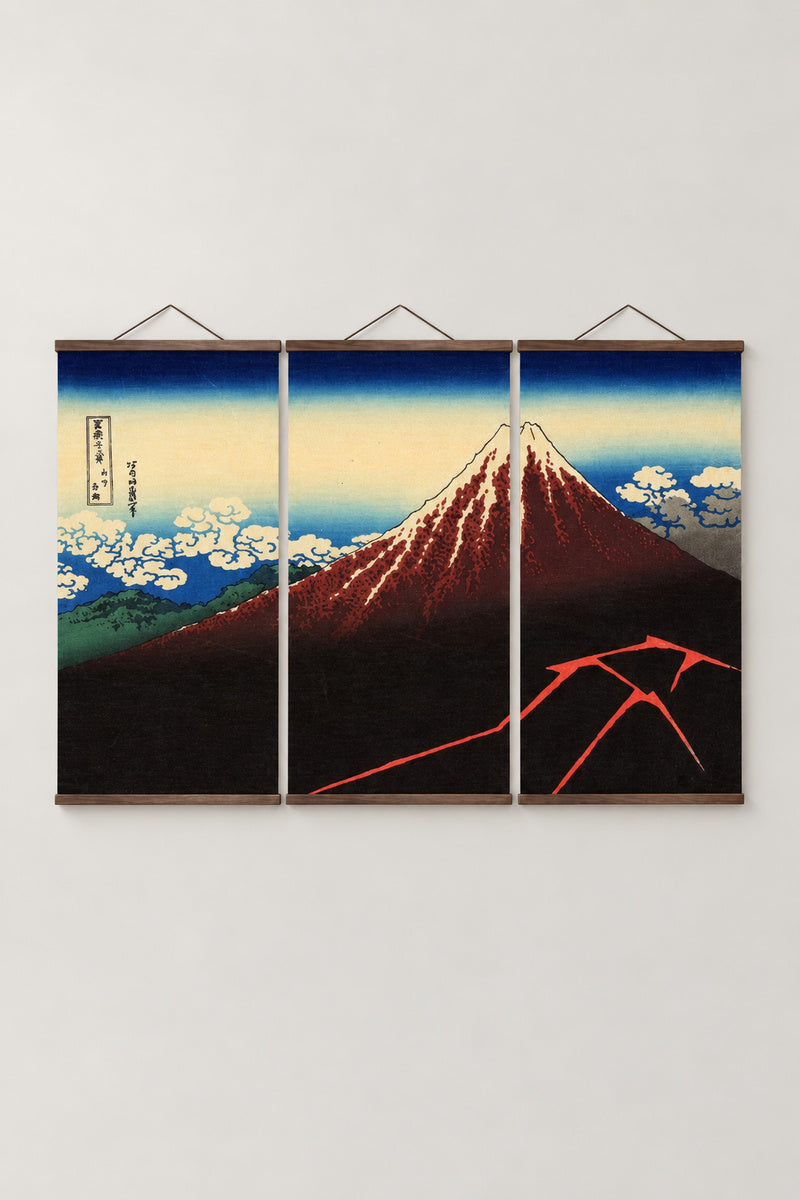 Mount Fuji Storm Triptych Wall Art 'Hakuu' – Rainstorm Beneath the Summit, Fuji in a storm with lightning from Hokusai's Thirty-six Views of Mount Fuji, three-panel triptych on wooden hanging rails, Japanese wall art, studio view