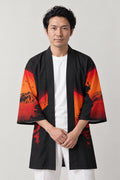 Mountain Sunset Happi Coat 'Yuyake' – black happi coat with orange mountain sunset landscape print, Japanese happi coat, unisex festival jacket, front view on model