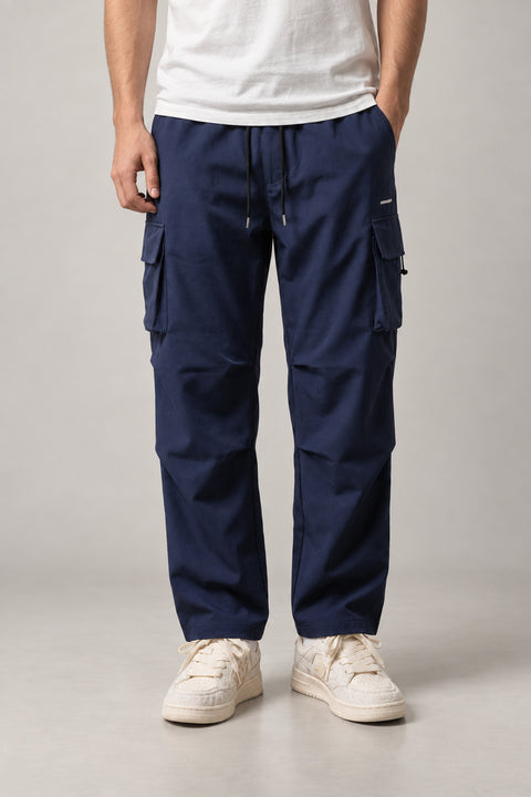 Navy Baggy Cargo Trousers 'Yuttari' – navy baggy cargo trousers with side pockets and drawstring, Japanese streetwear trousers, front view on model